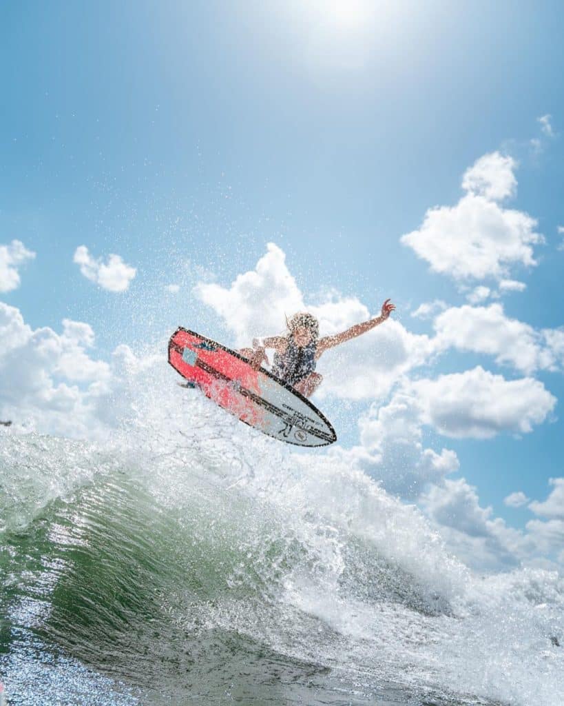 Ashley Kidd launches a big air while wakesurfing