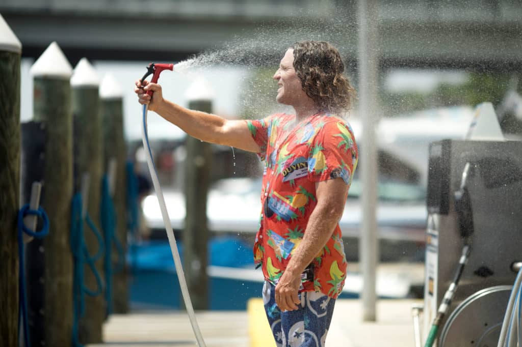 Parks Bonifay getting sprayed with a hose