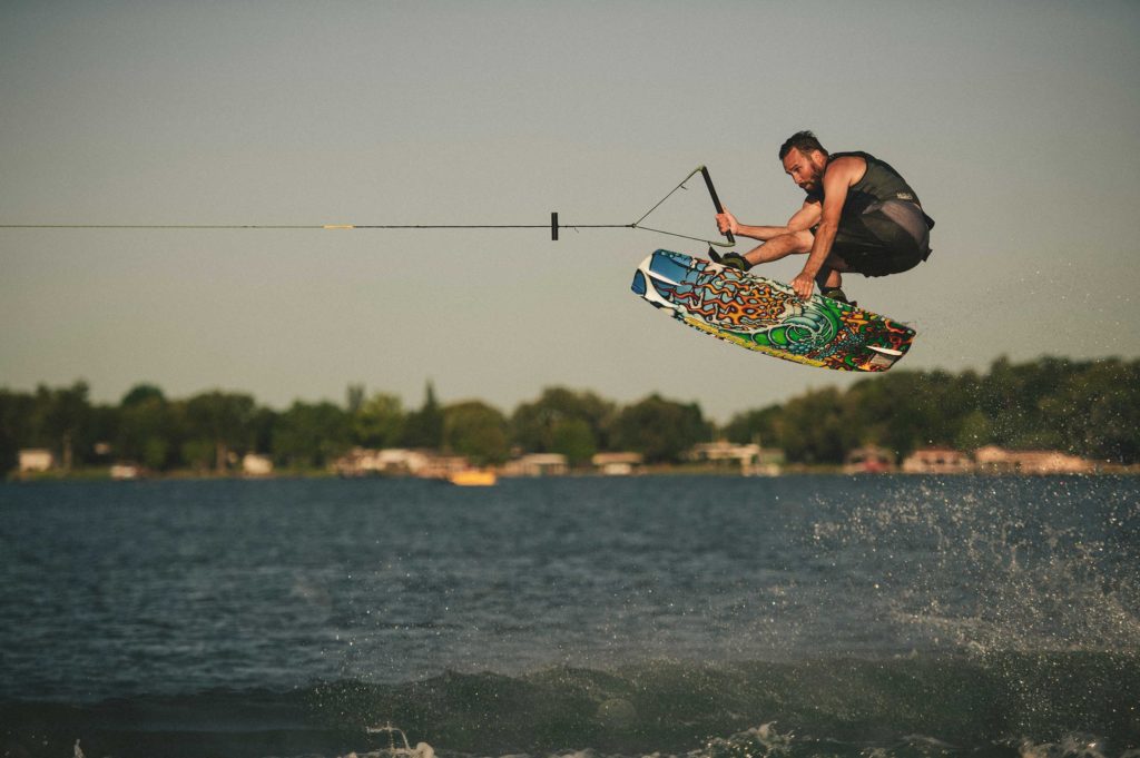 Rider jumping wake on a Liquid Force wakeboard