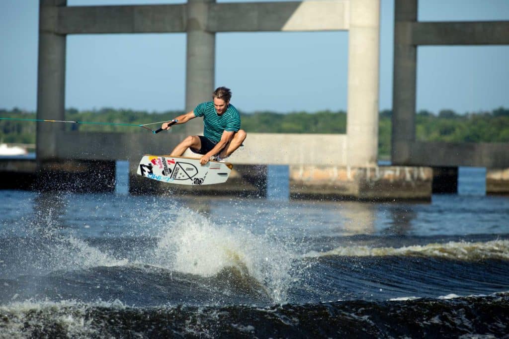 Brian Grubb riding under a bridge