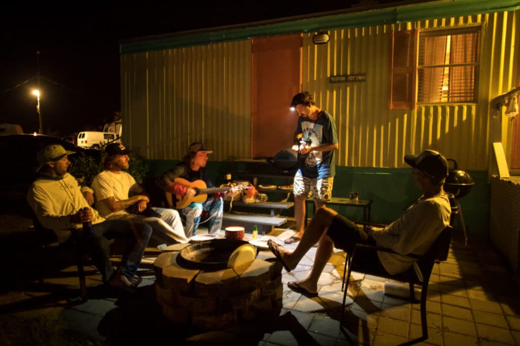 Playing guitar around the fire