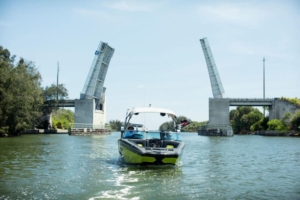 Running a wake boat under a drawbridge