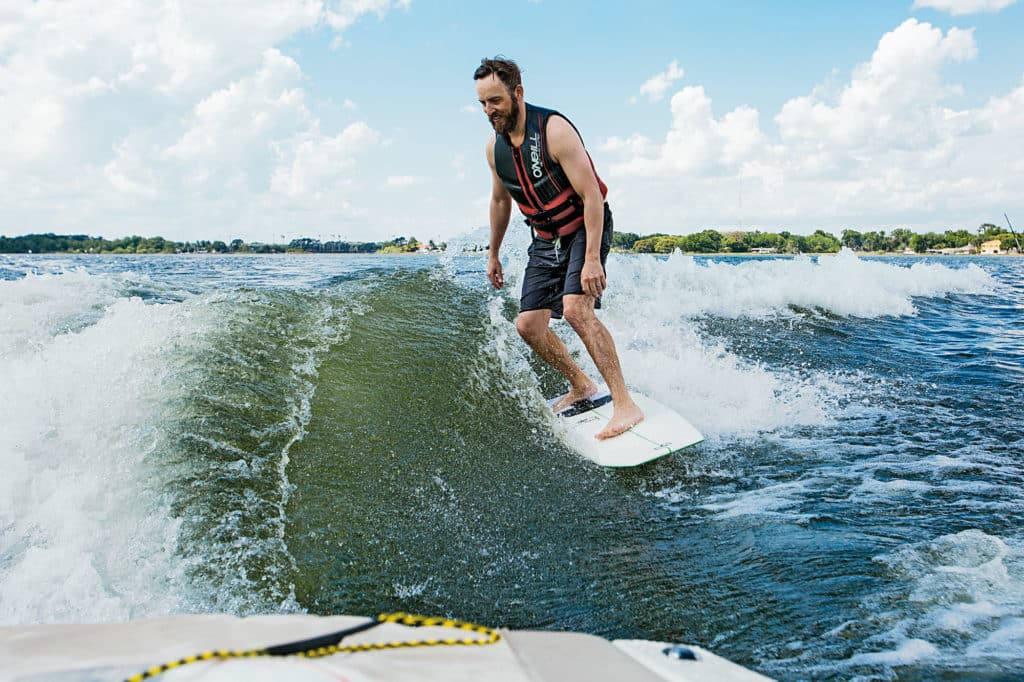 Wakesurfing behind Malibu Sunsetter