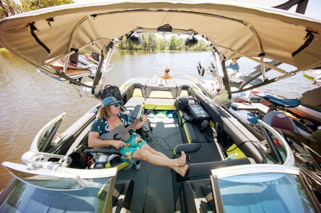 Parks Bonifay playing guitar on the boat