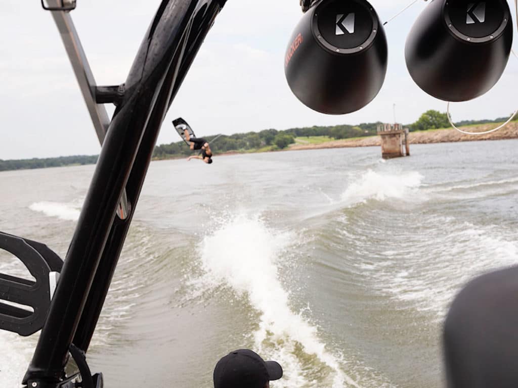 Rider behind boat equipped with KICKER speakers