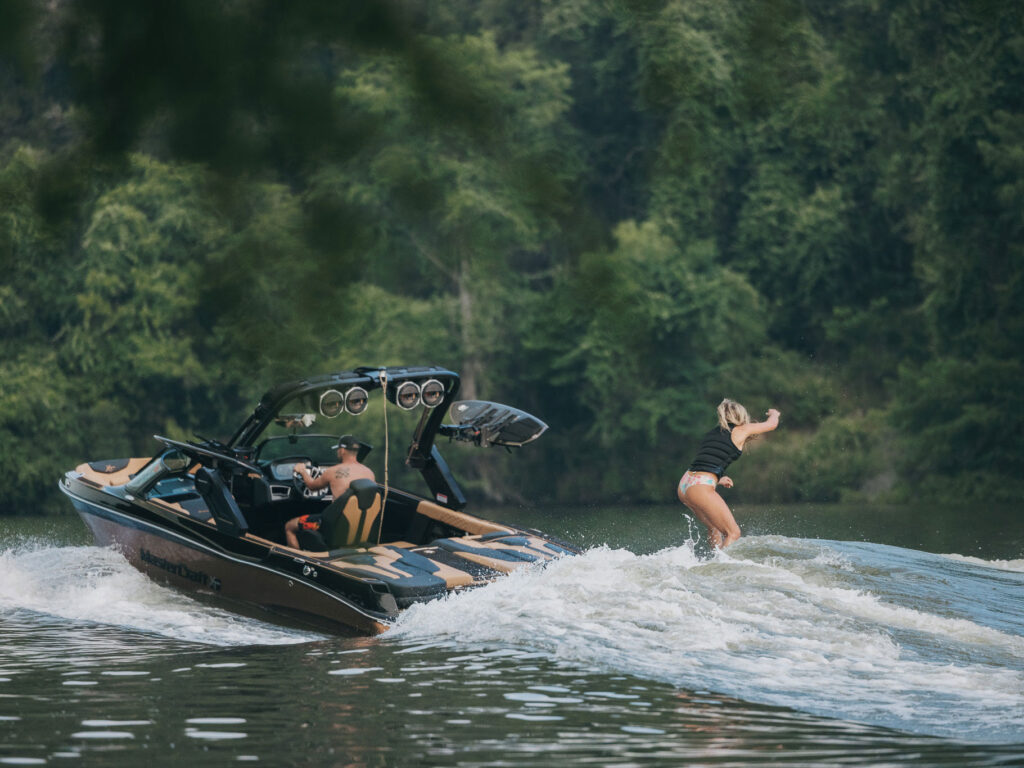 Ashley Kidd riding behind her MasterCraft XT23