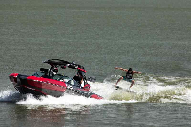 Chris Wolter wakesurfs in the Supra Pro Wakeboard Tour at Trinity Trails at Marine Creek Lake in Dallas, Texas.