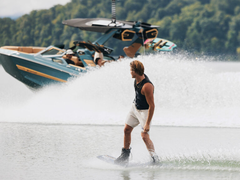 Wakeboarder wit Mastercraft boat in background