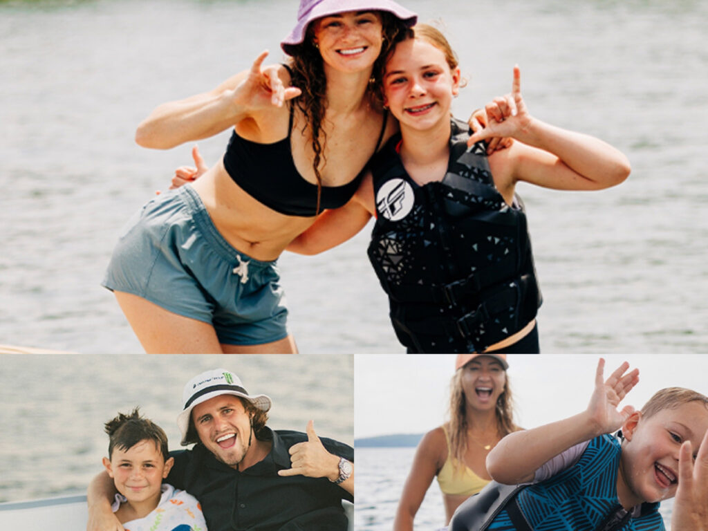 People posing for pictures on the water