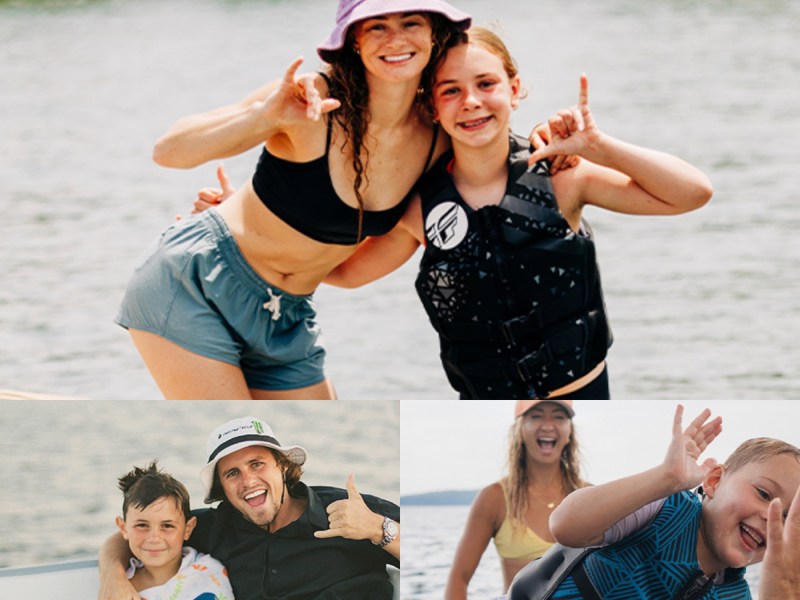 People posing for pictures on the water