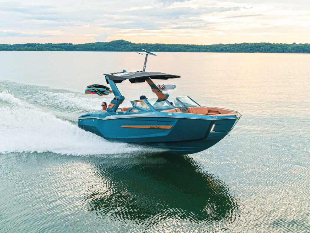 MasterCraft X24 on a glassy lake