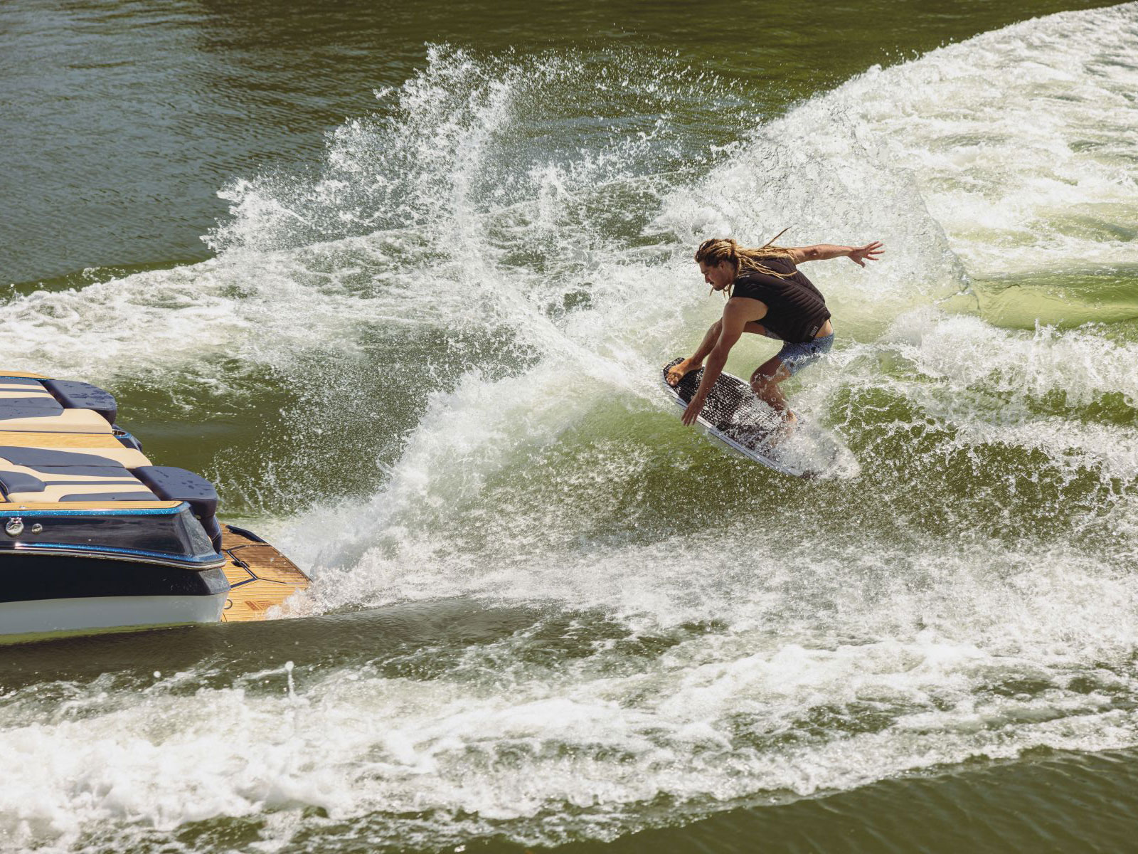 Wakesurfing behind a boat